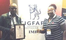 FOR GOOD GOVERNANCE: Enoch Mgijima budget and treasury political head Madoda Papiyane, left, and executive mayor Lindiwe Gunuza-Nkwentsha display an award for clean governance, which was received from the Institute for Municipal Finance Officers in Durban recently 