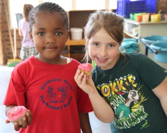 Enjoying cupcakes as part of Balmoral Girls' Primary School's 55th birthday, from left, pre-primary pupils Iyazi-Lomso Kobese and Maritza Jordaan 