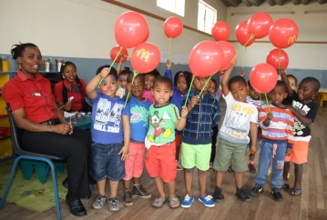 Playways pre-schoolers had fun during a visit by McDonalds staff, from left, Phumeza Maseti and Vuyiseka Mjalo 
