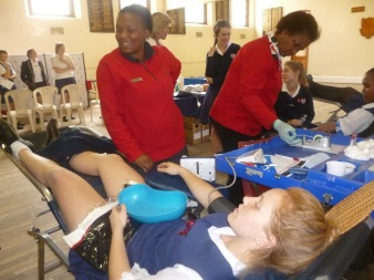 Carmen McEwan of GHS giving blood 