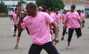 Trainer Brian Luthuli leads the group of aerobics fans at the Johnny's Gym marathon in aid of Cansa Picture: ABONGILE SOLUNDWANA