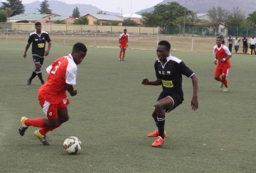 NO WAY THROUGH: Aviwe Baartman, left, of Lion City tries to run past Thobile Mkhize during the Nedbank Cup qualifiers at the Dumpy Adams sports ground on Saturday Picture: BHONGO JACOB