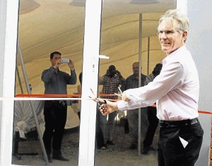 NEW BEGINNINGS: Cargo Carriers CEO Murray Bolton cuts the ribbon at the entrance of the new Ezethu Logistics satellite deport in Queendustria last weekPicture: BHONGO JACOB