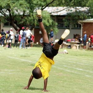 EXCITEMENT PRESENTS ITSELF: Christ the King Academic Warriors had their sports day on Friday. Delighted pupil showing off his cartwheel skills at the Sandringham sports grounds.  Picture: SUPPLIED